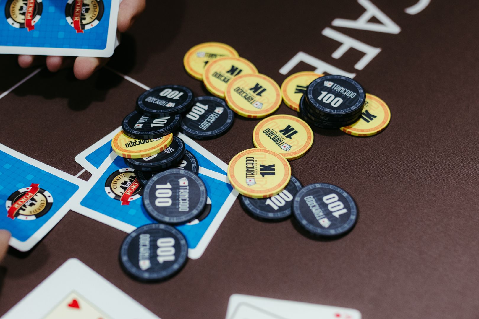 Poker chips and playing cards on a tournament table